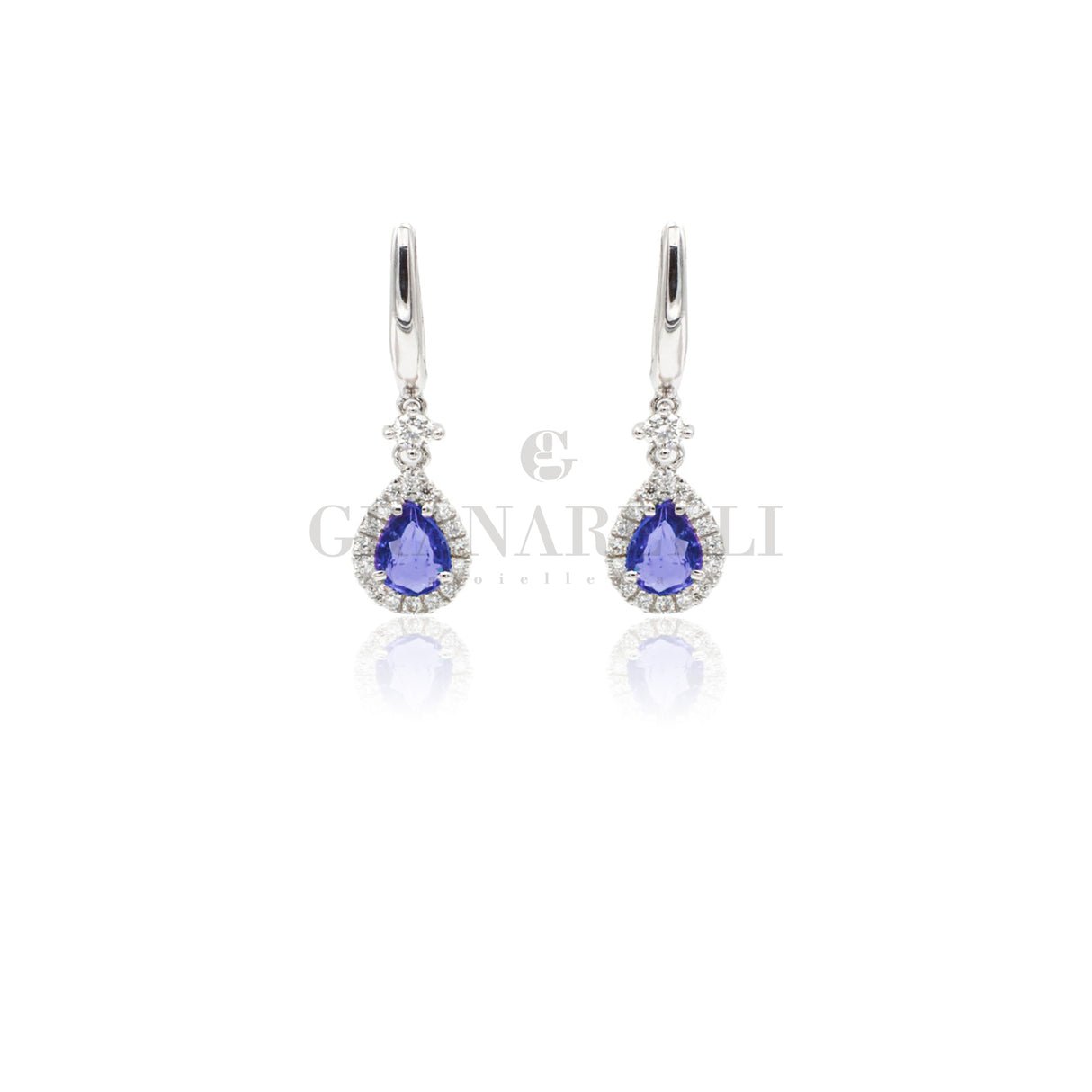 Boccola con goccia di zaffiri 0,82ct contorno diamanti in oro bianco