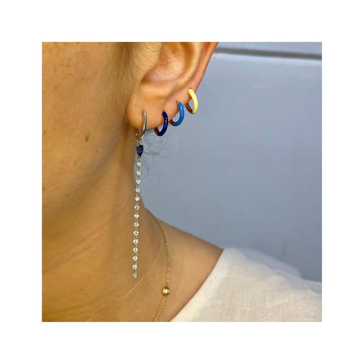 White gold earrings with sapphires and pending diamonds